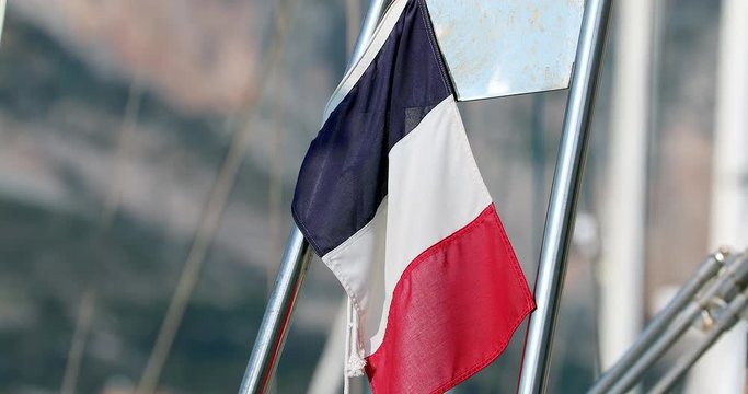 French Flag or Tricolor Flying From The Stern of a Boat