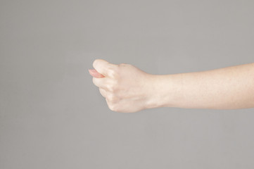 Fico gesture of a hand on a white background