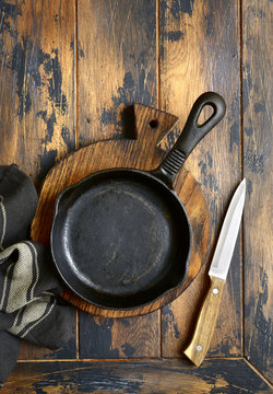 Empty cast iron  pan .Culinary background,top view with copy space.