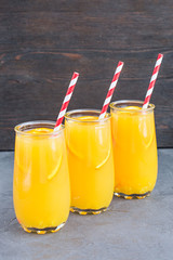 Three glasses of delicious citrus juice