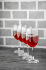 Red semi-sweet wine in glasses. Concept restaurant, alcohol, party.