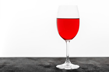 Tasty red wine in a glass. Copy space. Concept restaurant, alcohol, party.