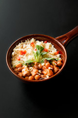 Close up of a Tajine, Morocco meal on a black table
