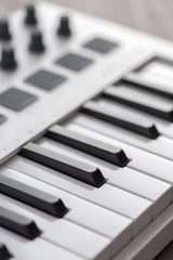 MIDI keyboard with pads and faders.