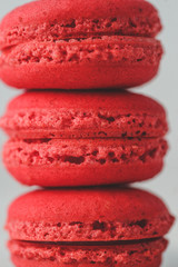 Red macarons arranged one over another. Close up.