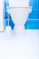 White toilet bowl in a bathroom