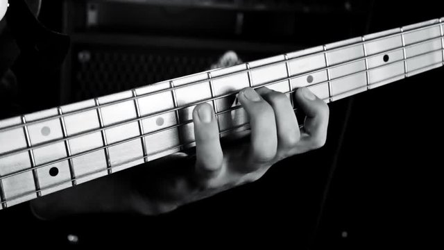 Bass Guitarist Playing Bass Guitar Close Up