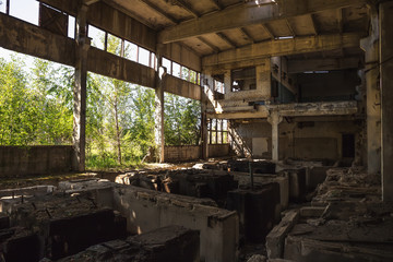 Fototapeta na wymiar Abandoned ruined industrial factory building, ruins and demolition