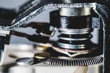 Detailed background image from auto part. Automotive mechanism with spring close-up.