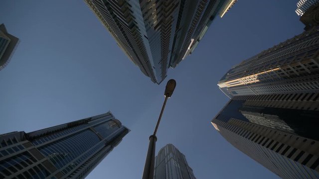 Low angle of skyscrapers and a street light 