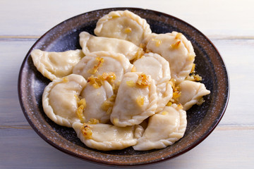 Plate of pierogi or varenyky, vareniki, Dumplings, filled with potato. Pyrohy - dumplings with filling