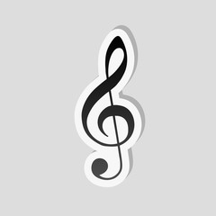 Simple icon of treble key. Sticker style with white border and simple shadow on gray background