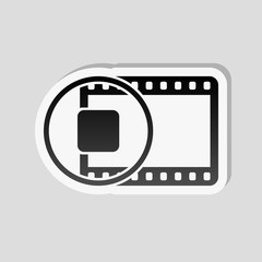 movie strip with stop symbol in circle. simple silhouette. Sticker style with white border and simple shadow on gray background