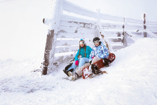 Young couple at snowy resort. Winter vacation