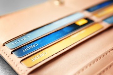 Leather wallet with many credit cards, closeup