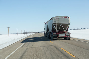 rear view of a semi truck on the highway