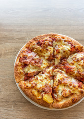 Delicious italian pizza served on wooden table