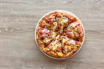 Delicious italian pizza served on wooden table