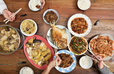 Top view of Chinese family enjoying dinner  
