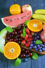 Fresh fruits on wooden background, Healthy diet.