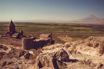 Khor Virap Monastery top view. Mountain Ararat on background. Exploring Armenia. Armenian architecture. Tourism and travel concept. Religious landmark. Tourist attraction. Copy space for text