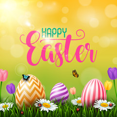 Colorful Easter eggs with flowers and insects on the grass