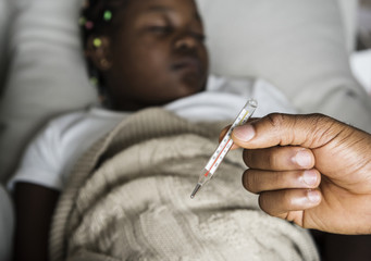 Girl sleeping with sickness on the bed