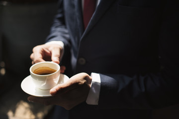A businessman  having coffee