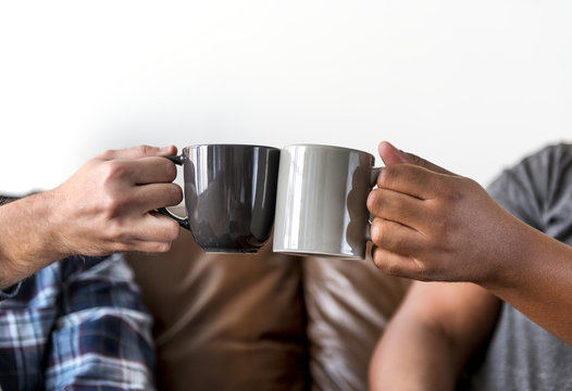 Men Toasting Coffee Cup Together