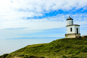 Fototapeta na wymiar Lighthouse on coast