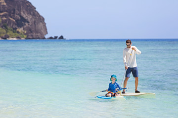family stand up paddleboarding