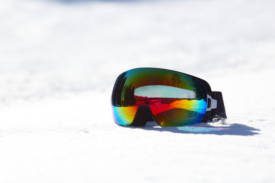 Ski and snowboard mask in snow