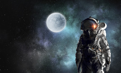 Obraz na płótnie Canvas Astronaut explorer in space. Mixed media