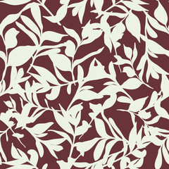 Background seamless pattern of tossed leaves on burgundy