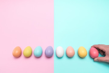 hand taking away red easter egg on the right side