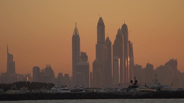 Dubai Marina's skyscrapers seen at dusk 