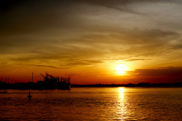 Fototapeta na wymiar silhouette of a cargo ship on the sea