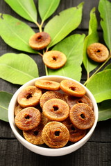 Top view -vegan diet food- dried figs in white bowl.