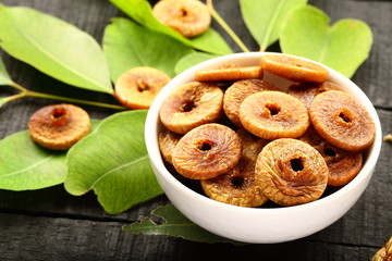 Vegan diet concept - healthy dried figs in bowl.