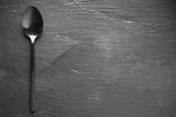 Black silverware on slate