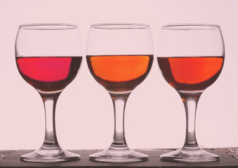 Three glasses of wine, tinted