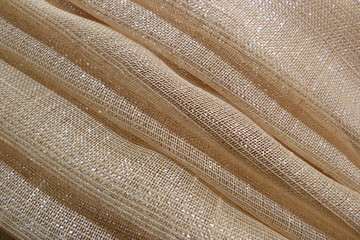 gold fabric brocade organza silk beige brown lurex fabric structure closeup background backdrop...