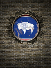 Old Wyoming flag in brick wall