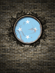 Old Micronesia flag in brick wall