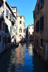 Fototapeta na wymiar Venetian Gondolas in a side canal just off The Grand Canal, Venice