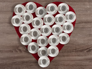 Heart shape made with white empty coffee cups