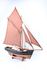 Miniature of a pirate sloop ship brown and black isolated in white background