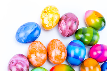 Top view of Colorful hand painted easter eggs with white background