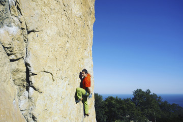 Rock-climbing in Turkey. The climber climbs on the route. Photo from the top.