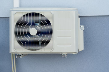 Cooling Fan Air Conditioner on blue wall background